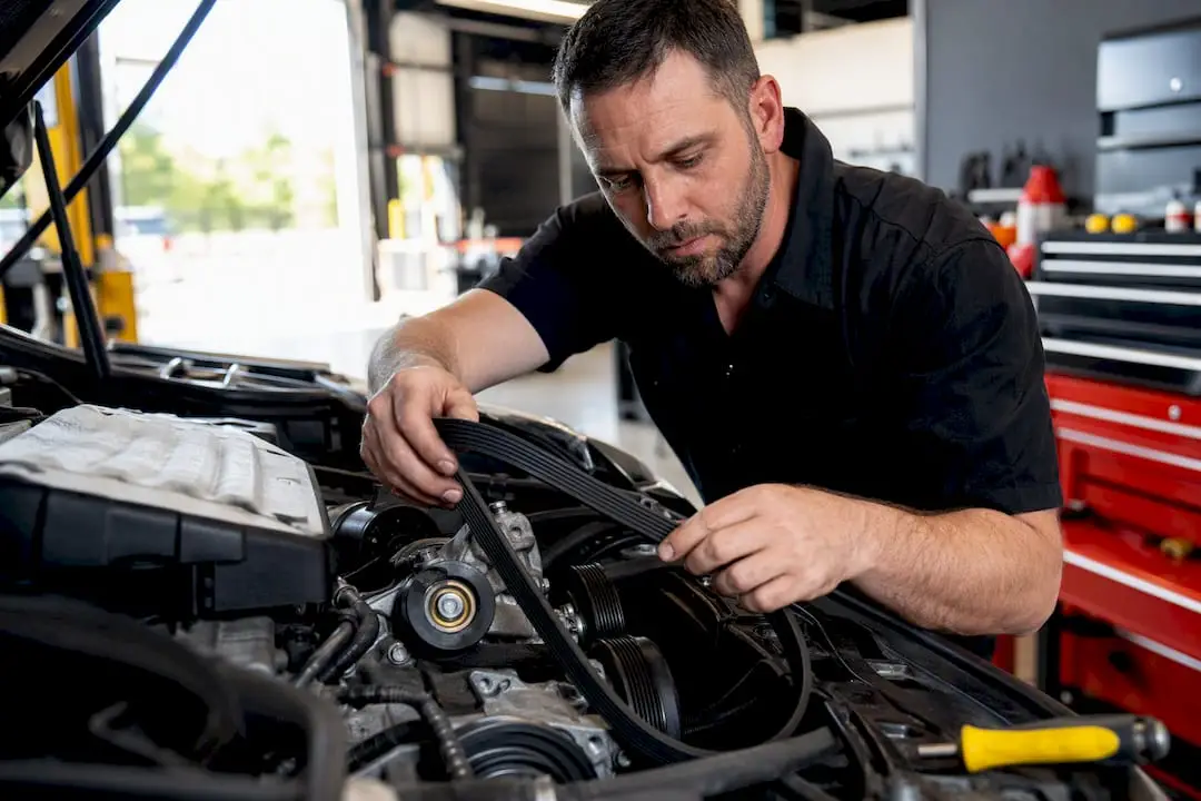 Technician routing a serpentine belt